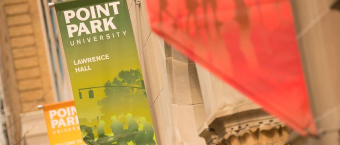 Image of Point Park banners on the exterior of Lawrence Hall. 