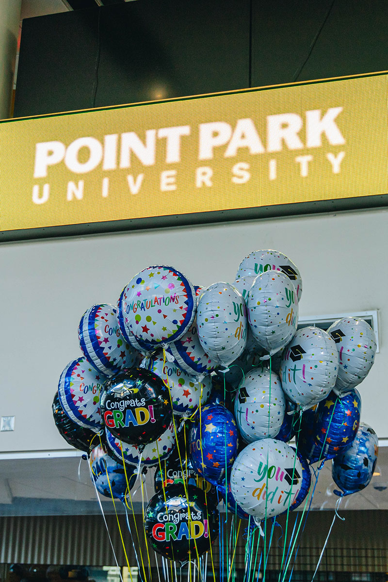 A bunch of congratulatory balloons.