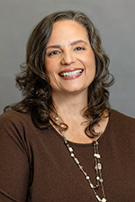 Natalie Rice in a traditional portrait with a gray background