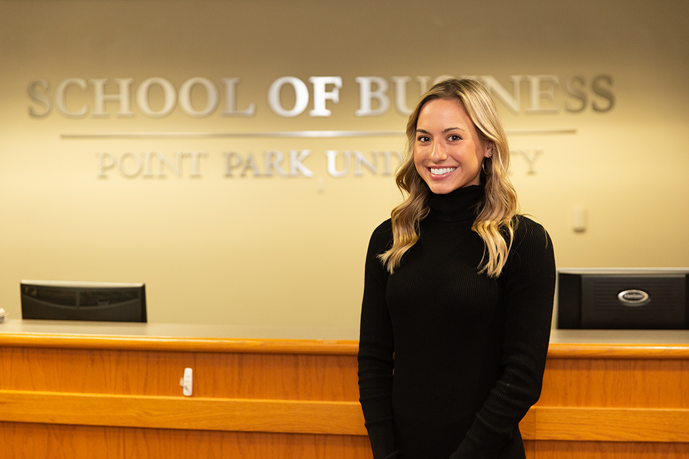 Pictured is MBA student Olivia Stawovy in the Rowland School of Business office in West Penn Hall. Photo by Randall Coleman.