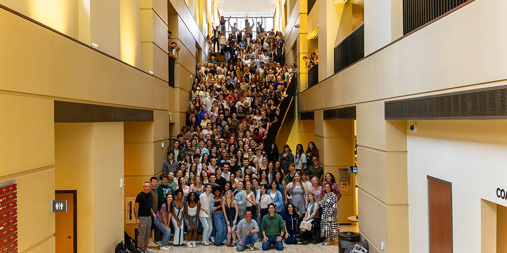 The Department of Theatre's students, faculty and staff on the grand stairc