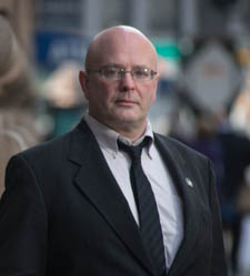 Pictured is Sean Elliot Martin, Ph.D., full-time instructor for the Department of Criminal Justice and Intelligence Studies. | Photo by Chris Rolinson