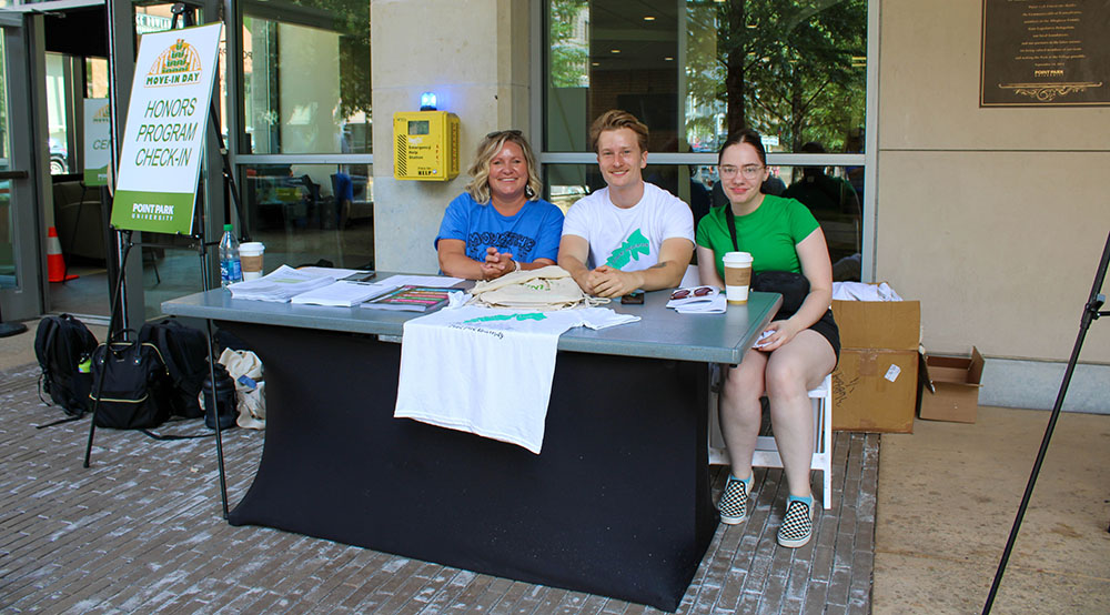 Pictured are Honors Program Director Jessica McCort, graduate student Kay In 't Ven and student Maegen Steiner during Honors Program move-in, fall 2023. Photo by Nadia Jones.