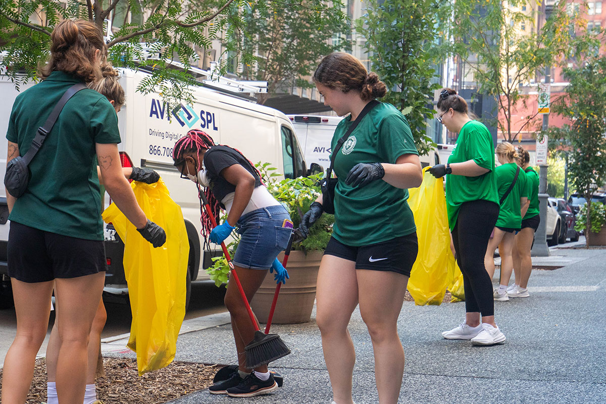 Student clean up the street.