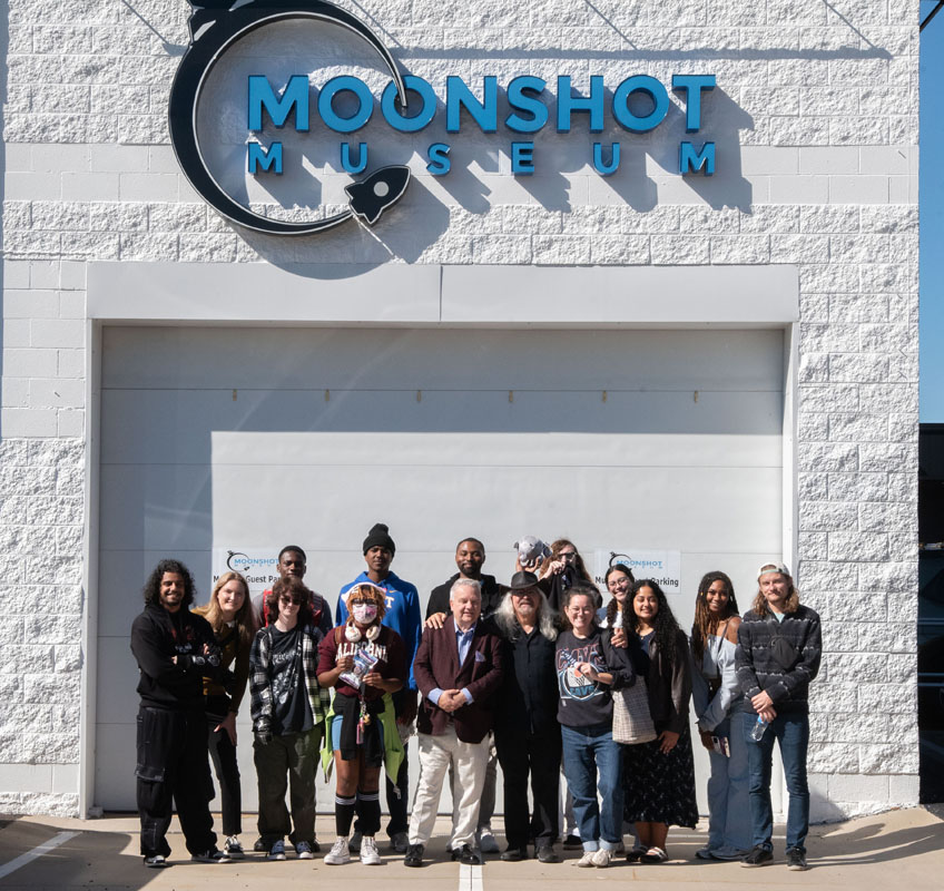 The CENT class poses outside the Moonshot Museum. 