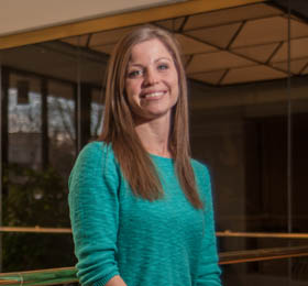 Pictured is public administration and M.B.A. alumna Michelle Herrle, a business systems analyst for Management Science Associates, Inc. | Photo by Chris Rolinson