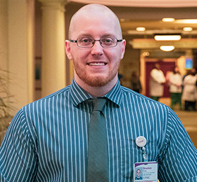 Pictured is M.S. health care management alumnus Braxton Bragg. Photo by Emma Federkeil.