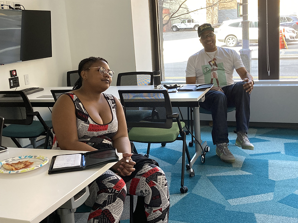 A student and Chuck Cooper III listen to Professor Robert Derda at the Cooper Gibson's Personal Branding and Networking Workshop, held April 23, 2022 at the Michael P. Pitterich Sales & Innovation Center at Point Park.