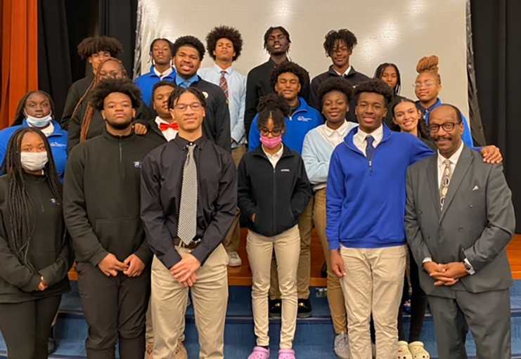 The Neighborhood Academy is another local school participating in Rising Brothers and Sisters. Pictured are Dr. Mitchel Nickols with students during an assembly at the school.