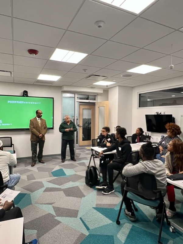 Faculty member Archish Maharaja, CFP, CPA/PFS, Ed.D., addresses attendees at a Rising Brothers and Sisters networking reception. Submitted photo.