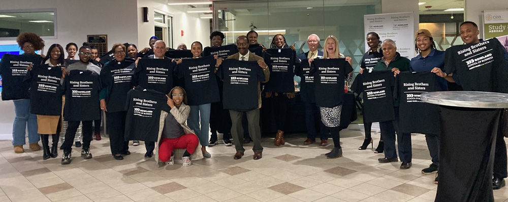 Pictured are students, faculty, staff and regional professionals at a Rising Brothers and Sisters networking reception. Submitted photo.