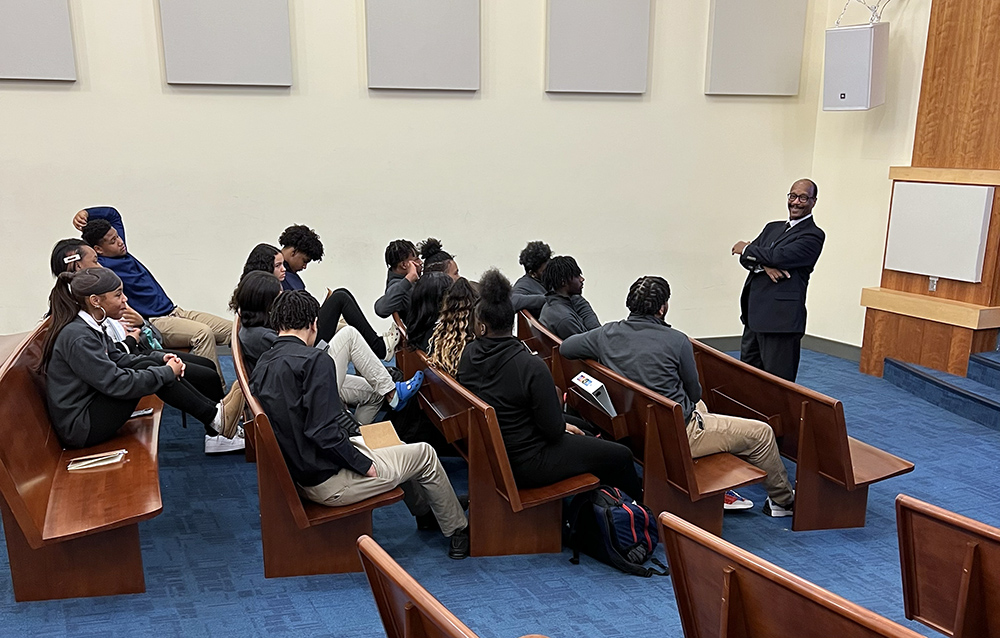 Mitchel Nickols, Ph.D., speaks to students at the Neighborhood Academy. Submitted photo.