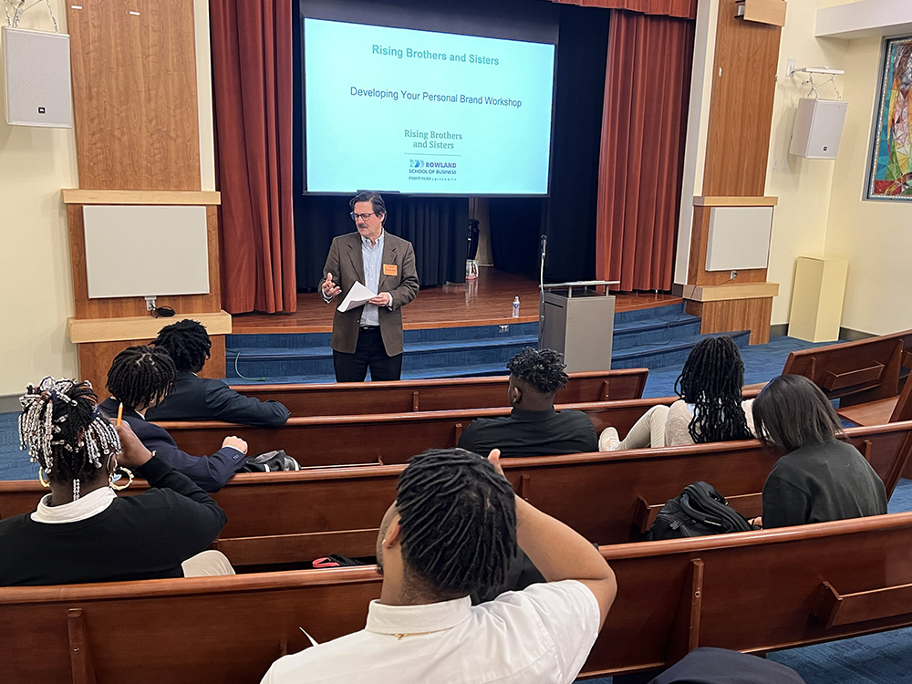 Rowland School of Business professor Robert Derda gave a presentation on personal branding at the Neighborhood Academy as part of the Rising Brothers and Sisters program. Submitted photo.
