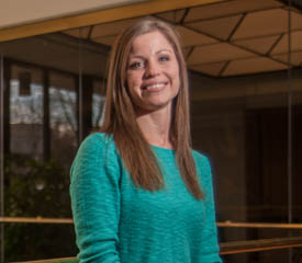 Pictured is public administration and M.B.A. alumna Michelle Herrle, a business systems analyst for Management Science Associates, Inc. | Photo by Chris Rolinson