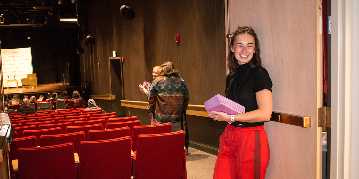 Pictured is a Point Park student working at the Conversations with Coco event.