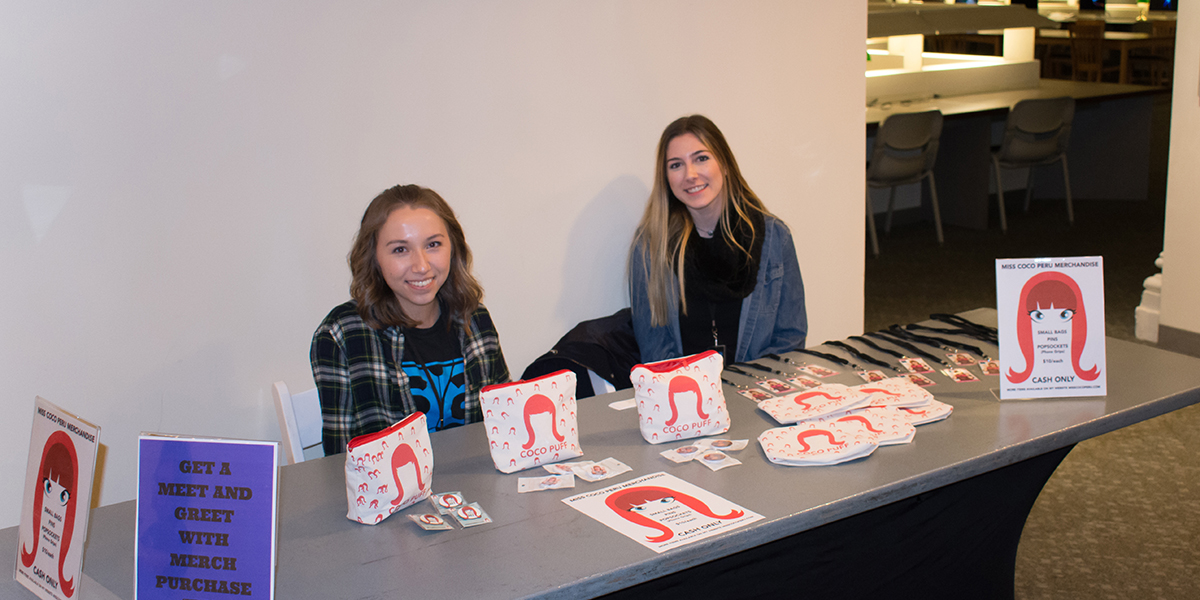 Pictured are SAEM students at the registration table for the "Conversations with Coco Peru" event.