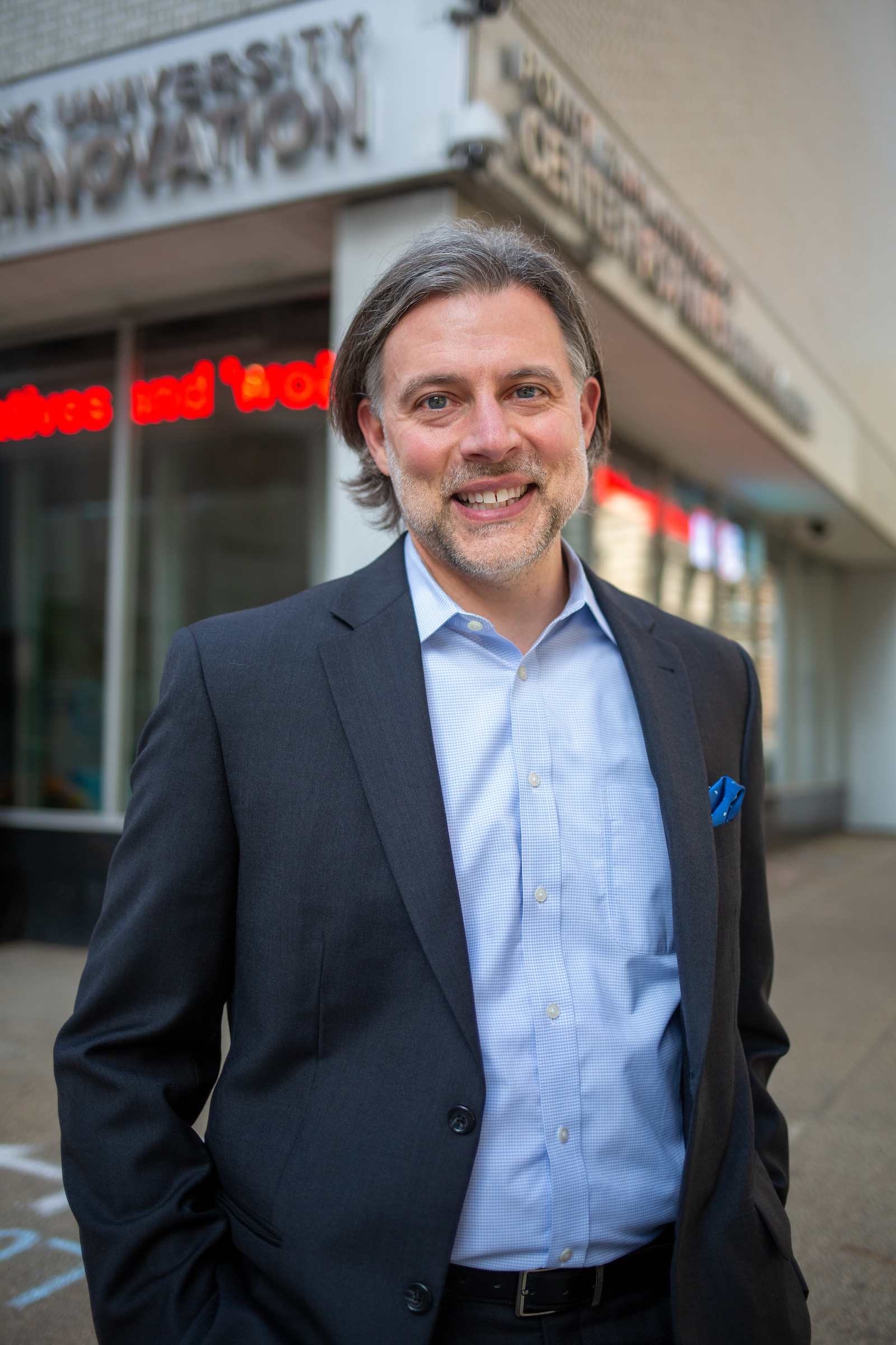 Image of Andrew Conte outside of the Center for Media Innovation