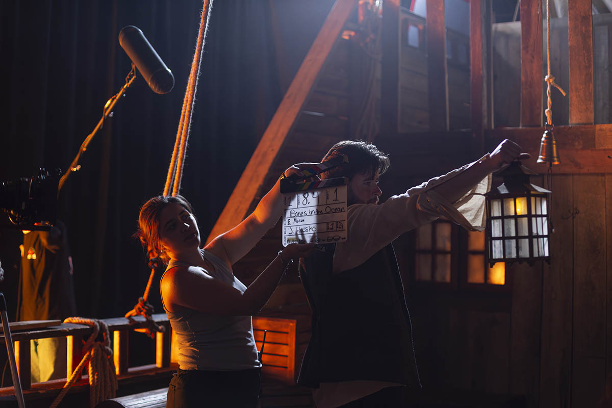 Students on set of a film shoot in the soundstage on campus. 