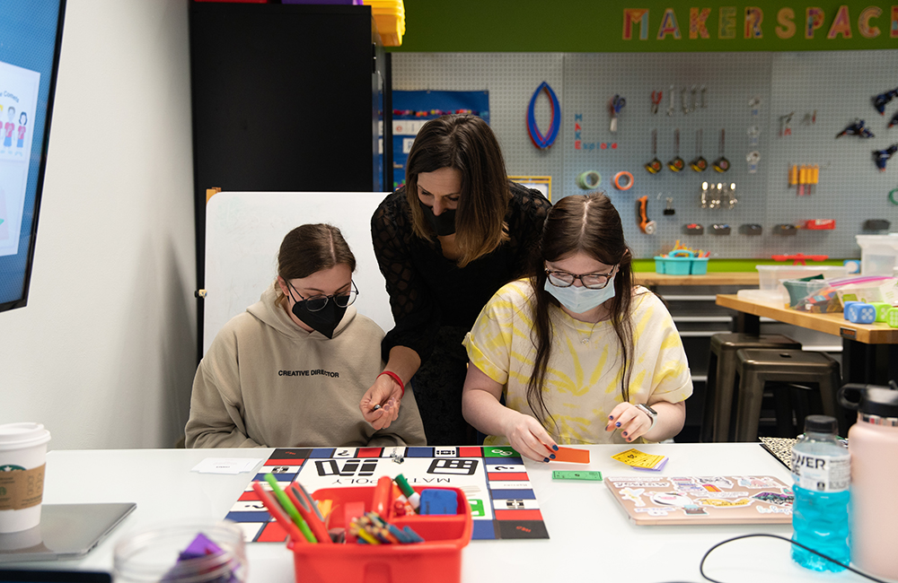 Pictured are two students and Dr. Kamryn York learning in the Matt's Maker Space Lab at Point Park University.