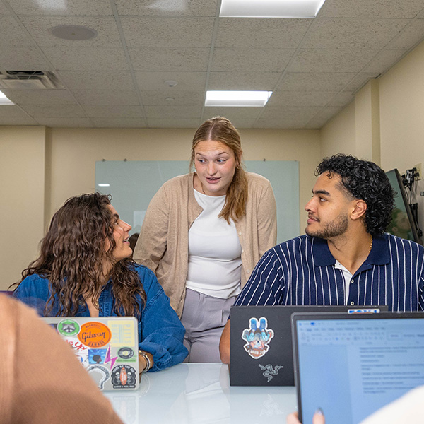 Students work in a business workshop session at Point Park University.