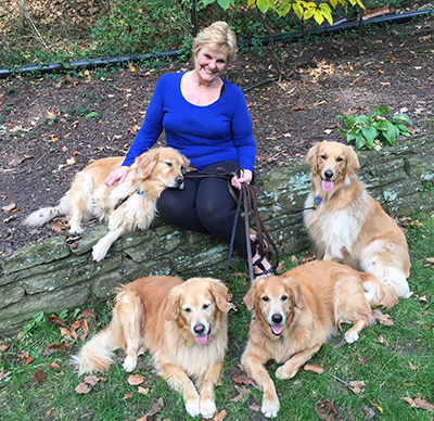 Pictured is Professor P.K. Weston with four golden retrievers. Photo submitted by Weston