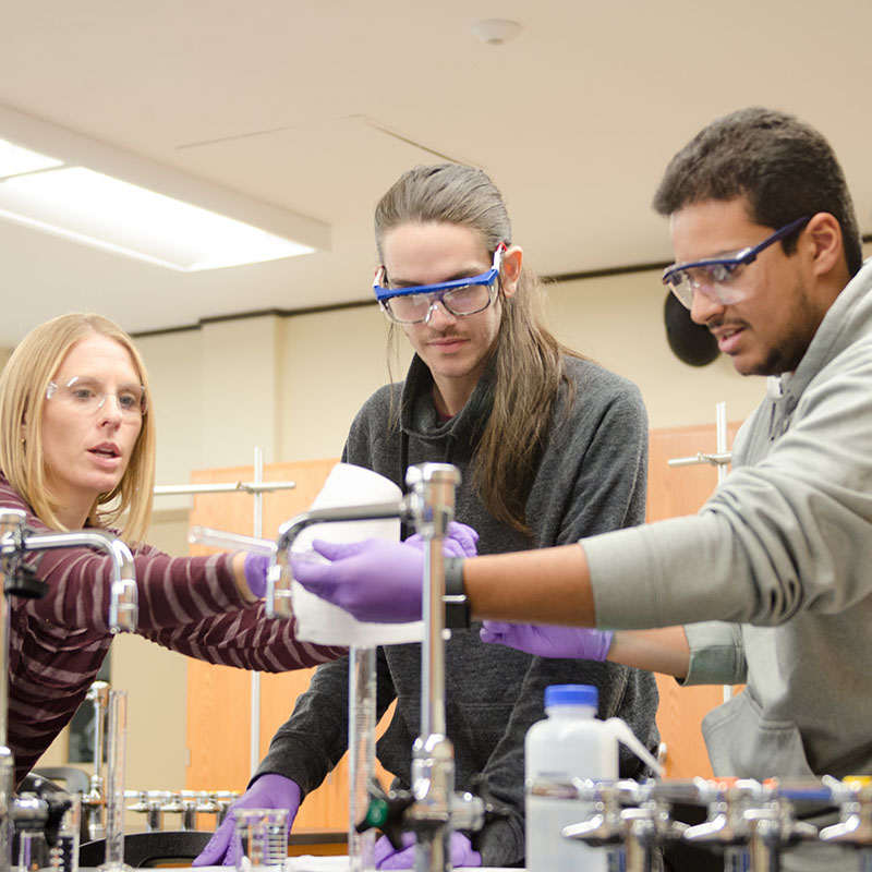 Pictured is Instructor Kristy Long in the lab with students.