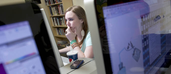 A School of Communication student works in a computer lab. Photo | John McKieth
