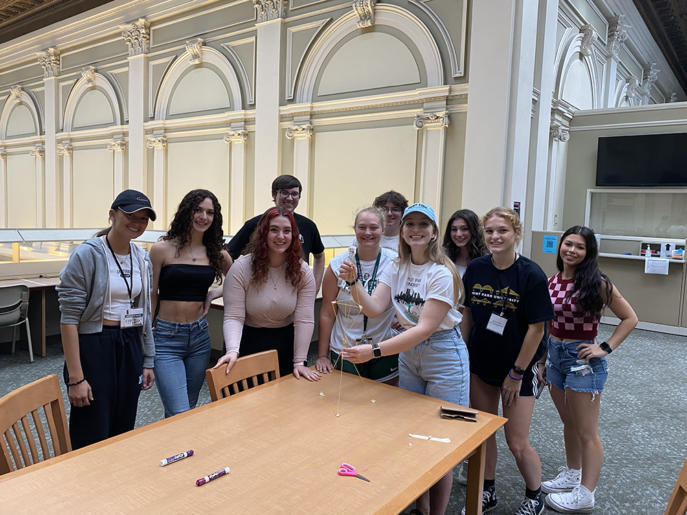 Pictured are Honors Program students competing in a building competition in Point Park's library during Fall 2022 Welcome Weekend. 