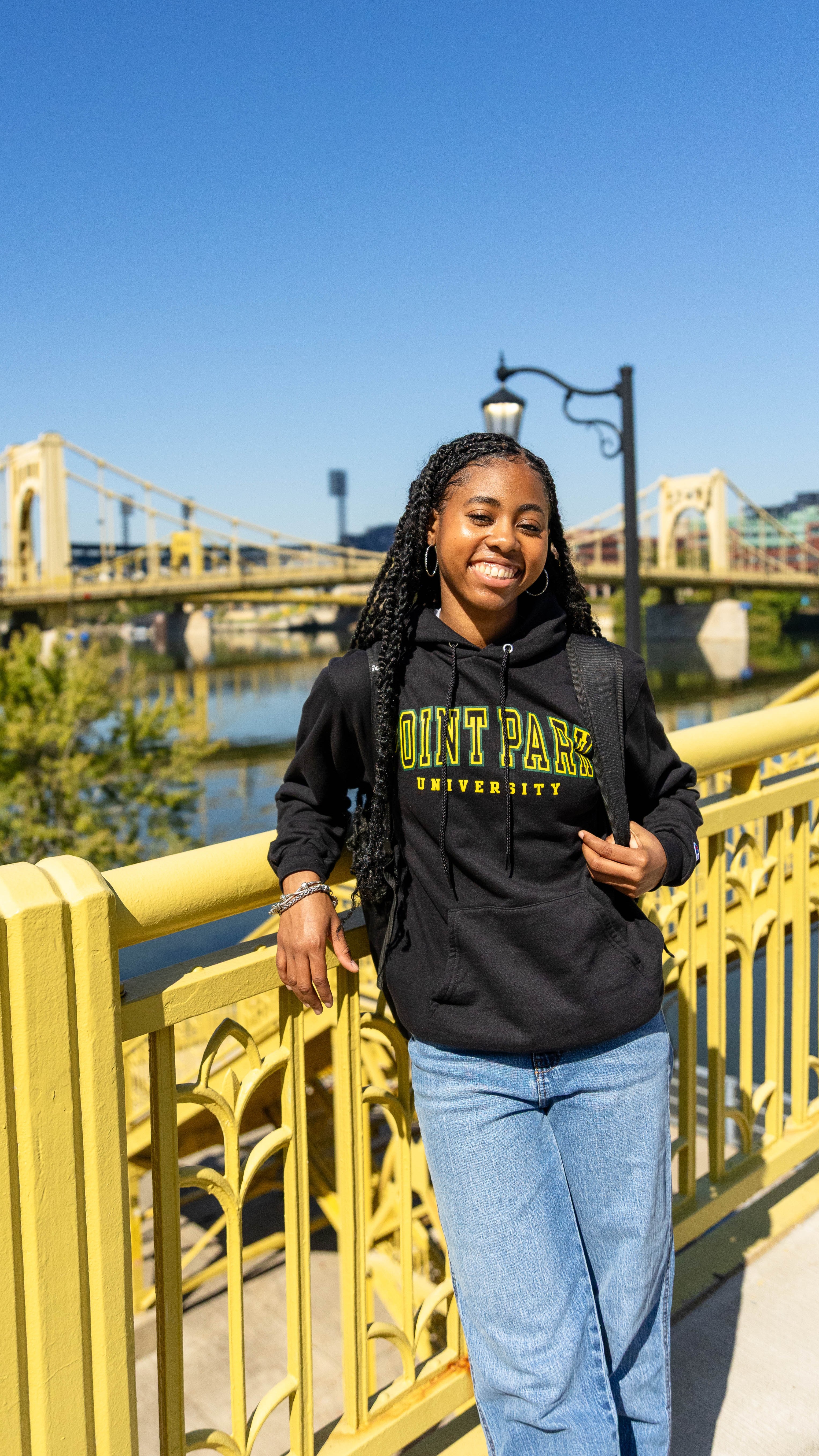 Pictured is a Point Park student standing infront of one of Pittsburgh's famous bridges. Photo by Paul Koontz.