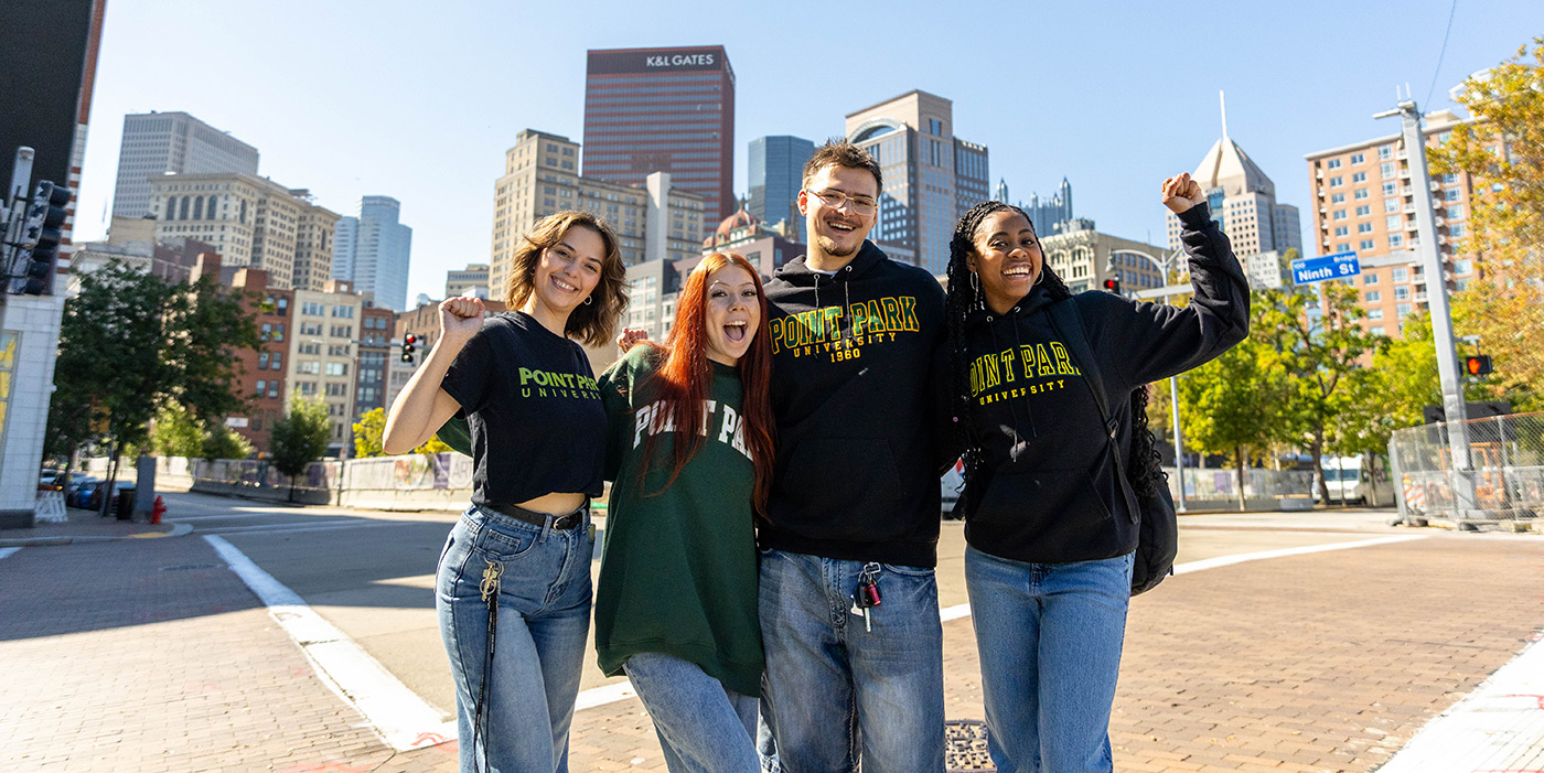 Point Park University students infront of city skyline. Photo by Paul Koontz.