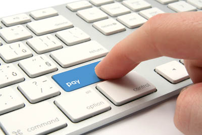 Stock image showing a finger touching a blue 