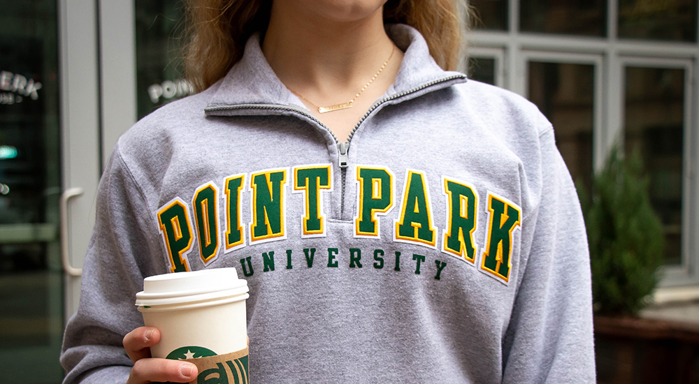 Pictured is a Point Park student in a Point Park sweatshirt. Photo by Mallory Neil.