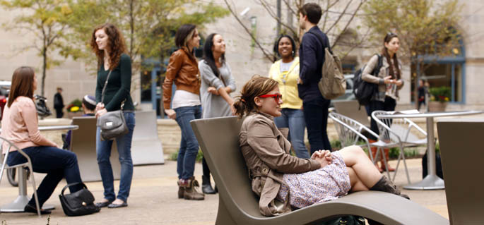 Students socialize in Point Park's Village Park. 