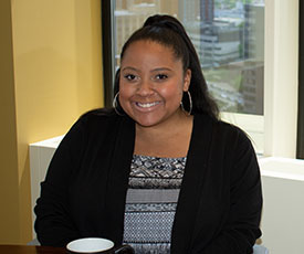 Pictured is business management alumna Erika Mangual. Photo by Brandy Richey.