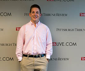 Pictured is Phillip Poupore, journalism major and copy editor intern for The Pittsburgh Tribune-Review | Photo by Victoria A. Mikula