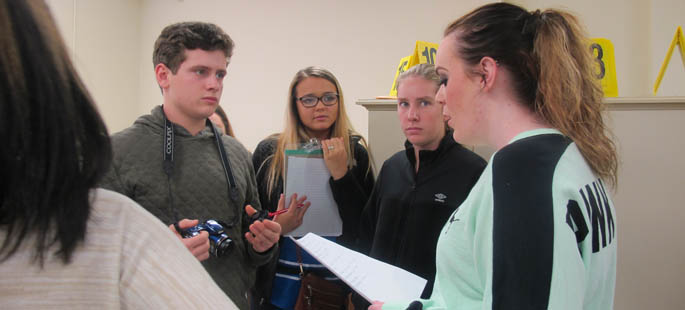 Pittsburgh Taylor Allderdice High School students process mock death scenes at Point Park's CSI House. | Photo by Amanda Dabbs