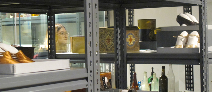 Pictured is a history student looking at artifacts at the Heinz History Center. | Photo by Amanda Dabbs