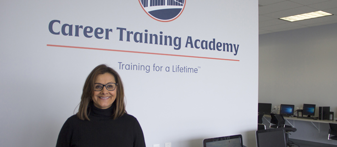 Pictured is Kimberly Rassau, M.A. in curriculum and instruction graduate and president and CEO of Career Training Academy. | Photo by Shayna Mendez