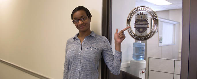 Pictured is Michael Hansom, criminal justice student and intern for the American Disabilities Act, Pittsburgh Department of City Planning. | Photo by Shayna Mendez