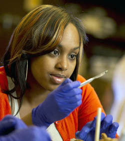 Pictured is a Point Park student in the biology lab.
