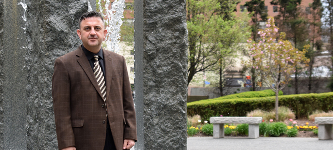 Pictured is Elvir Muslimovic, M.B.A. alumnus and supervisor of pricing operations for BNY Mellon. | Photo by Gracey Evans