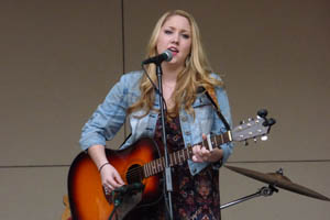 Pictured is Hannah Jenkins, the first artist featured on Point Park's new record label, Pioneer Records, singing live in Village Park. | Photo by David Rowell