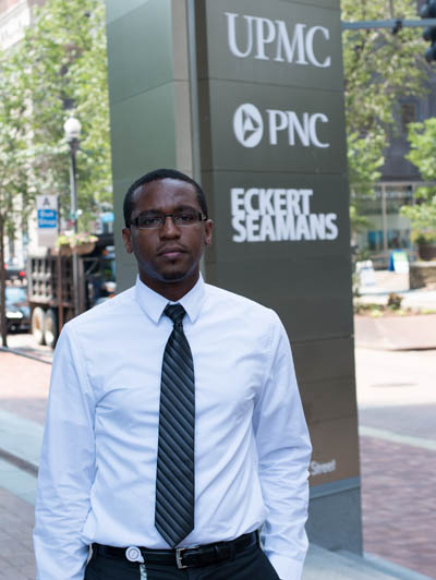 Pictured is business management and M.B.A. alumnus Kazoza Mazzuki, an ancillary analyst for UPMC Health Plan. | Photo by Victoria A. Mikula