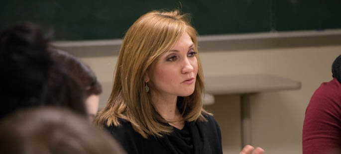 Pictured is Angela Ferguson, customer service development manager for Giant Eagle, talking with School of Business students. | Photo by Courtney L. Giles