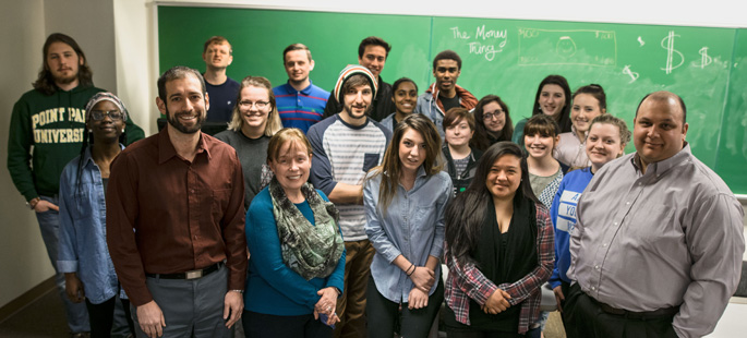 Pictured are Point Park faculty members Angela Isaac, Joseph DeFazio and David Diehl with students in The Money Thing course. | Photo by Daniel Kelly