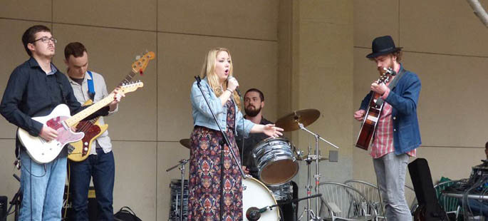 Pictured is Hannah Jenkins, the first artist featured on Point Park's new record label, Pioneer Records, performing live in Village Park. | Photo by David Rowell