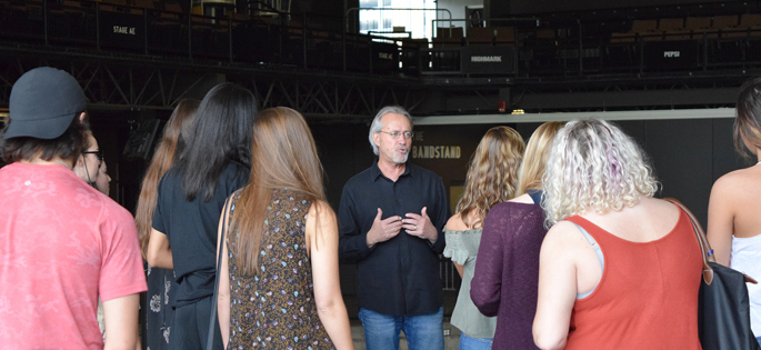 Pictured is SAEM Associate Professor Ed Traversari with students at SAEM High School Day at Stage AE. | Photo by Gracey Evans