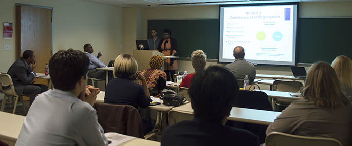 Ph.D. students present to the POISE Foundation for an assignment in the Program Development, Evaluation and Assessment course taught by Howard Slaughter, Jr., Ph.D. Photo | Shayna Mendez