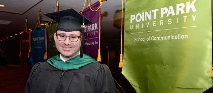 Pictured is M.A. in communication technology graduate Brian Miller. | Photo by Chris Rolinson
