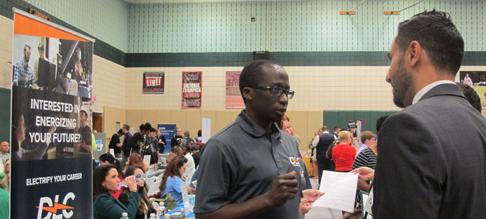 Pictured is a recruiter from Duquesne Light Company talking with a Point Park student at the Fall 2016 Internship and Job Fair on campus. | Photo by Amanda Dabbs